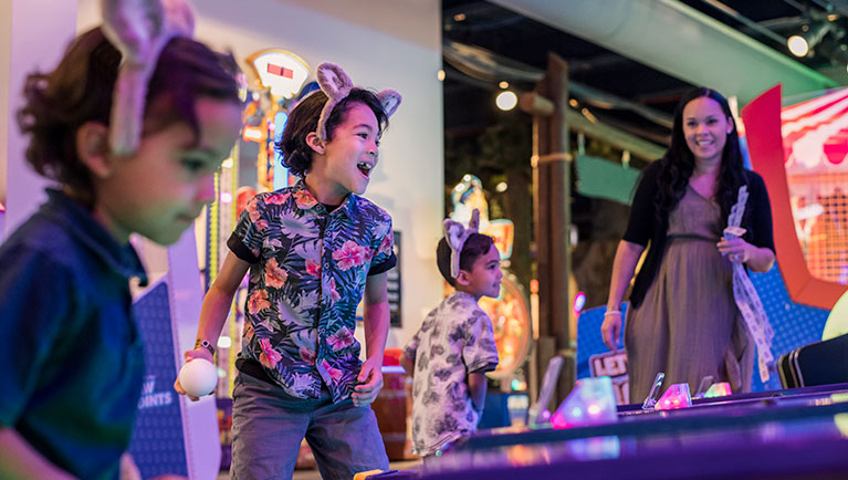 kids with wolf ears playing at arcade
